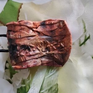 Handmade Clay Necklace on a Black Leather Cord with brass findings. 25"